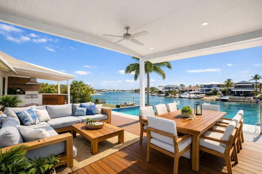 Modern coastal patio in Runaway Bay with outdoor seating and dining area designed for relaxed seaside living.