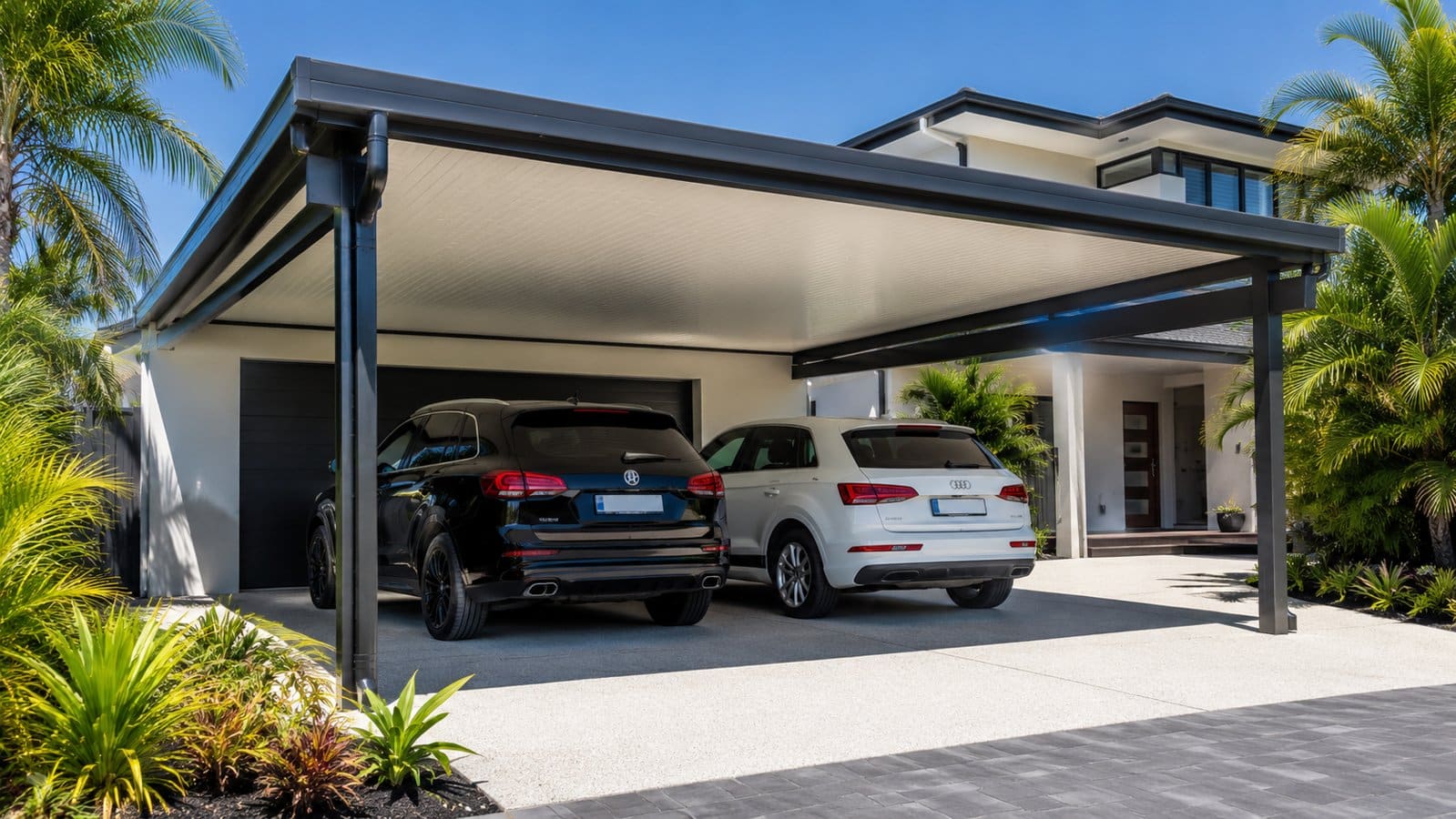 Modern insulated carport protecting vehicles from Queensland heat outside a contemporary Gold Coast home.