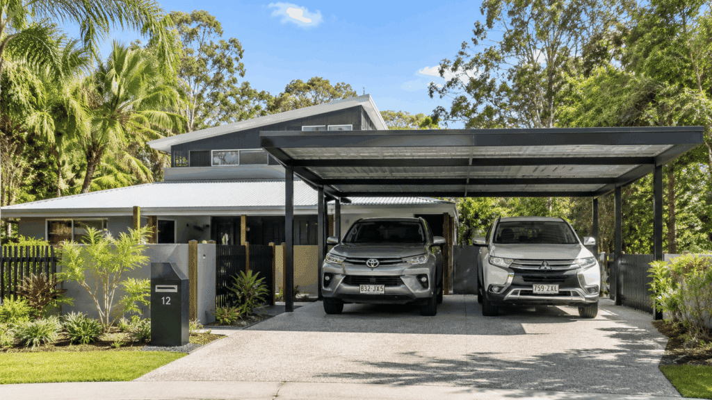 Carport Nerang 2 Modern Colorbond double carport at a contemporary Nerang home protecting two family SUVs.