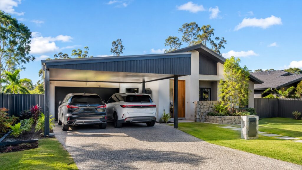 Carport Pacific Pines 2 Modern Pacific Pines family home with a Colorbond double carport protecting two SUVs.