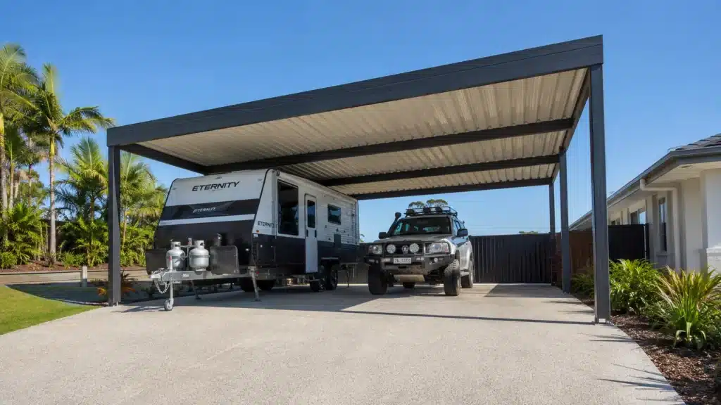 Carport Pimpama 3 High-clearance freestanding carport sheltering a caravan and four-wheel-drive vehicle.