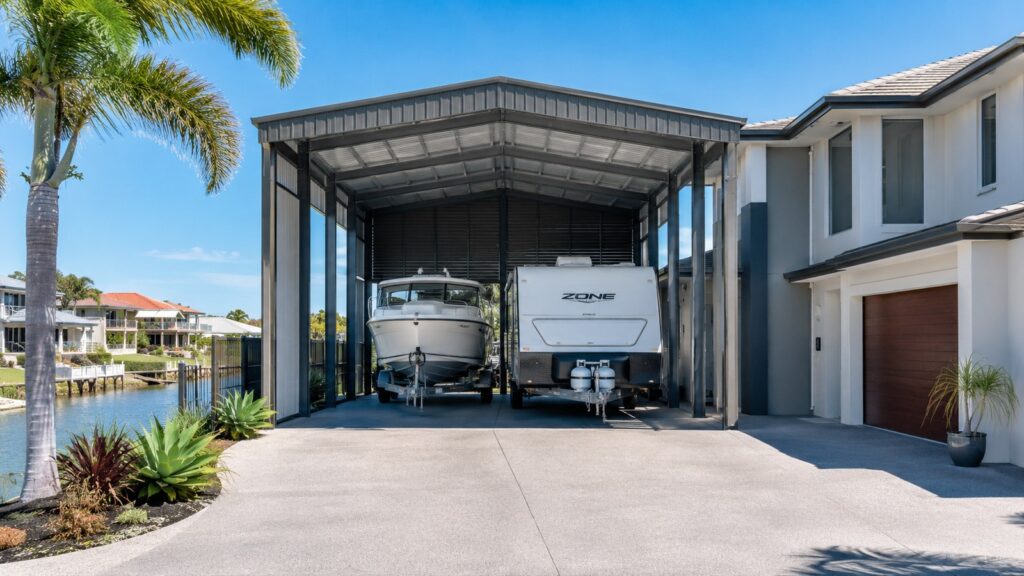 Carport Runaway Bay 3 Freestanding high-clearance carport sheltering a boat and caravan at a Runaway Bay home.