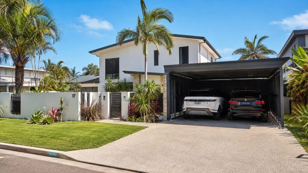 Carport Southport 2 Modern Southport home with a Colorbond double carport protecting two SUVs.