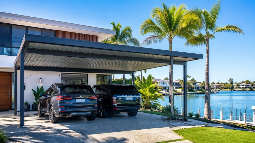 Custom Colorbond steel double carport at a modern waterfront home in Mermaid Waters.
